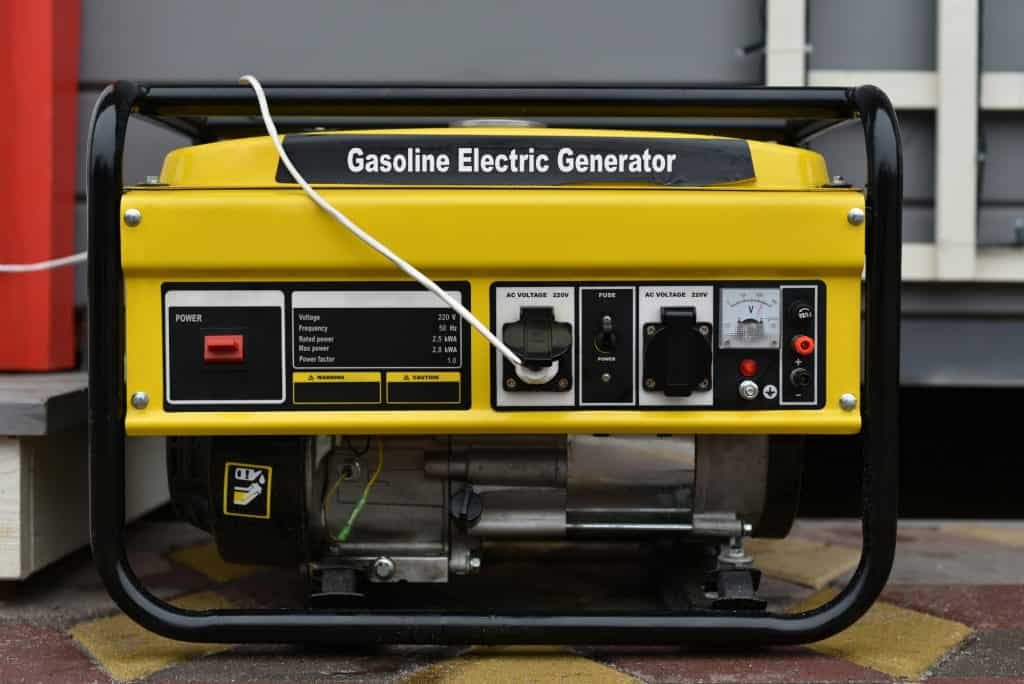 yellow electric gas powered generator with extension cord