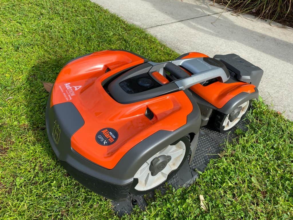 Husqvarna auto mower sitting on recharging base station